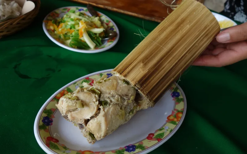 Pa'piong, chicken cooked inside a bamboo tube, served as a traditional Toraja dish