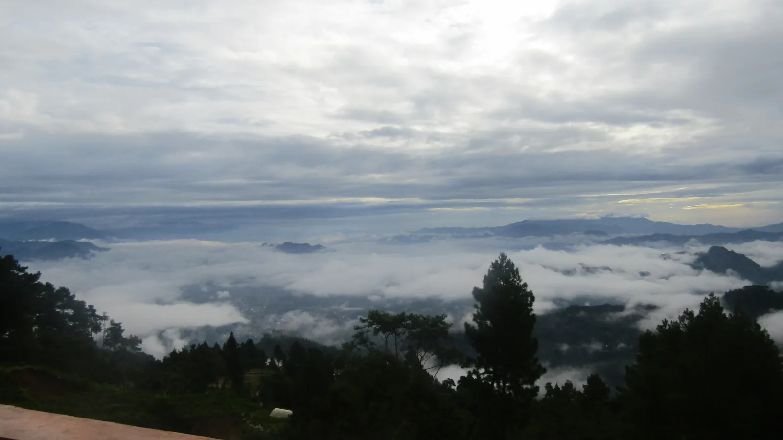 Mist filling the valleys below the Pango-pango highlands at dawn, Tana Toraja